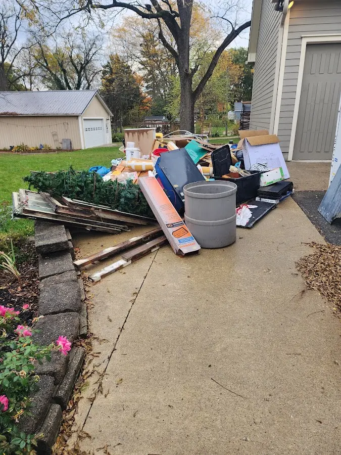 Dumpster being loaded with debris for 3 Yard Dumpster Rental in Prairie Village